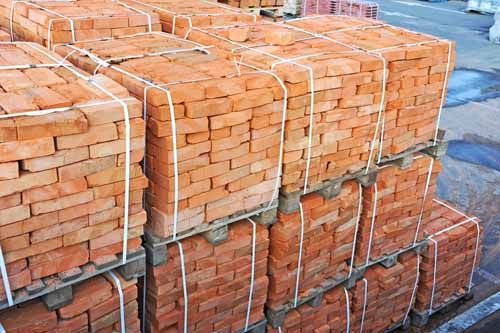 Bricks are stacked up, ready to be used in a project